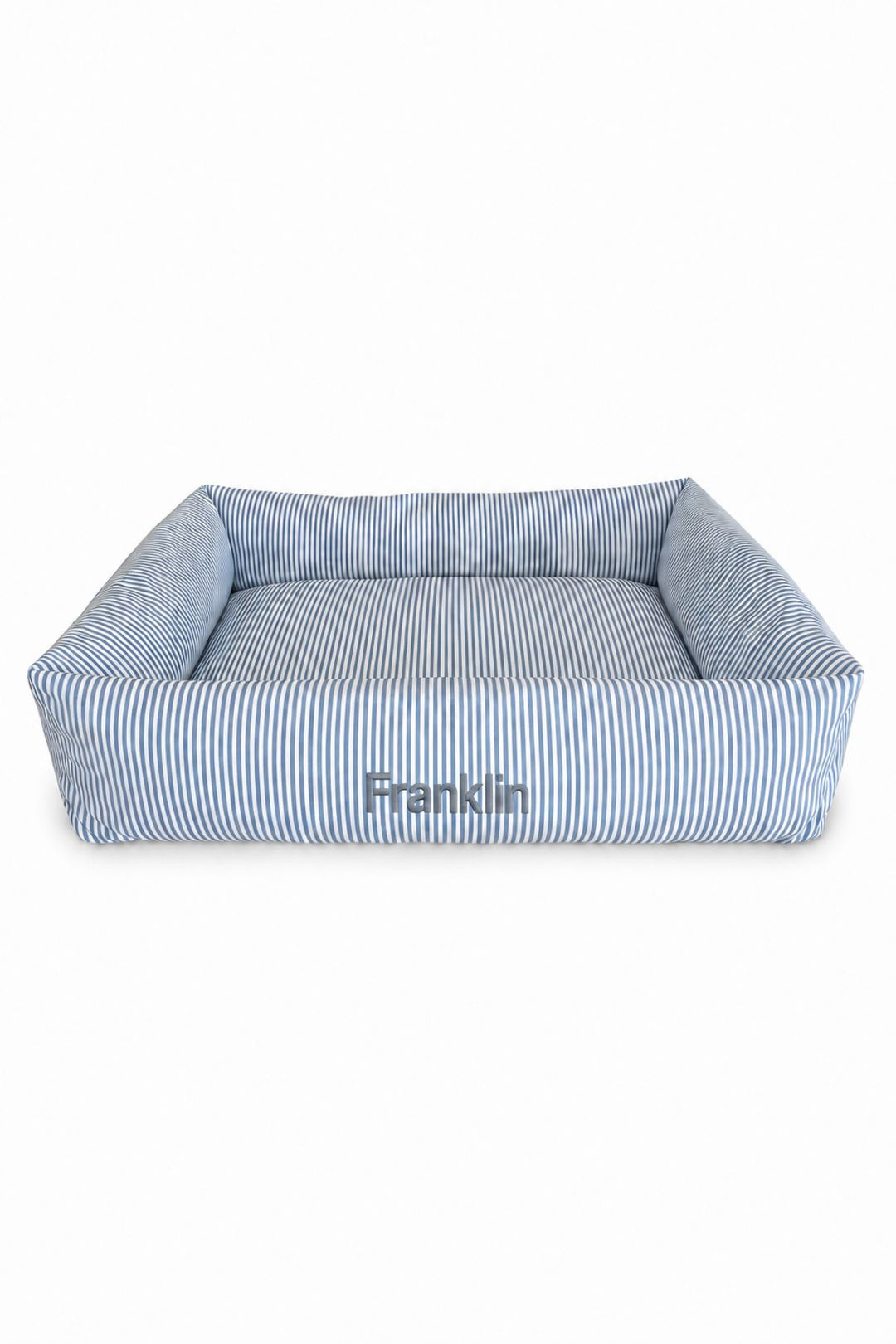 A square Lane & Leash pet bed with a blue and white striped fabric, featuring a raised bolster border and the name 'Franklin' printed on the front, set against a plain white background.