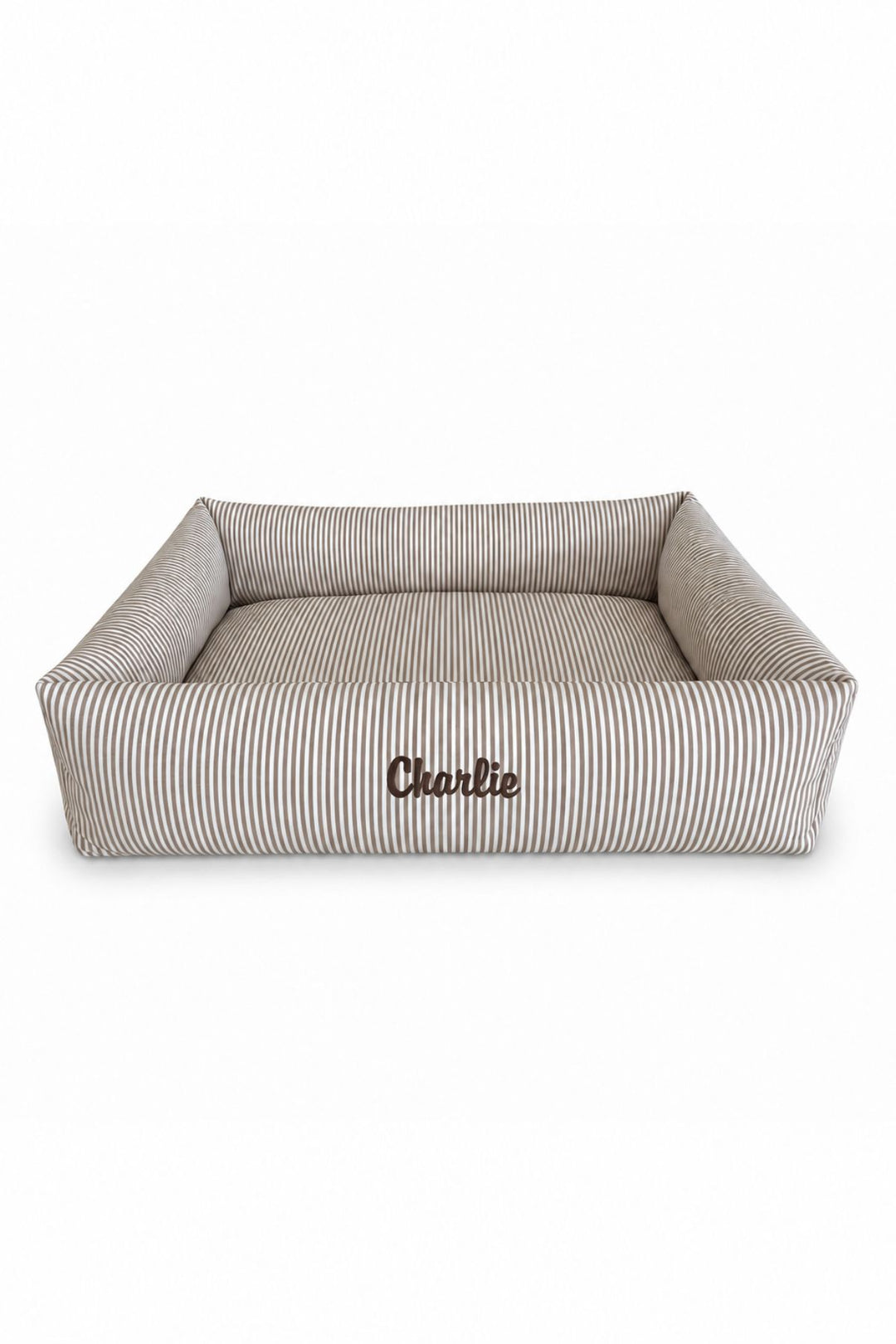A rectangular high-sided Lane & Leash pet bed with a beige and white vertical stripe pattern, featuring the name 'Cherlie' embroidered on the front, set against a plain white background.
