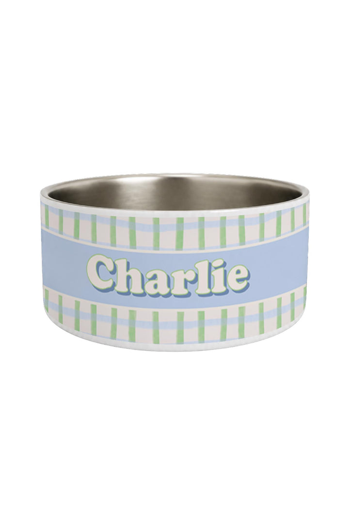 Personalized pet bowl in green and blue picnic plaid print with a blue personalization band and the name "Charlie" in white lettering