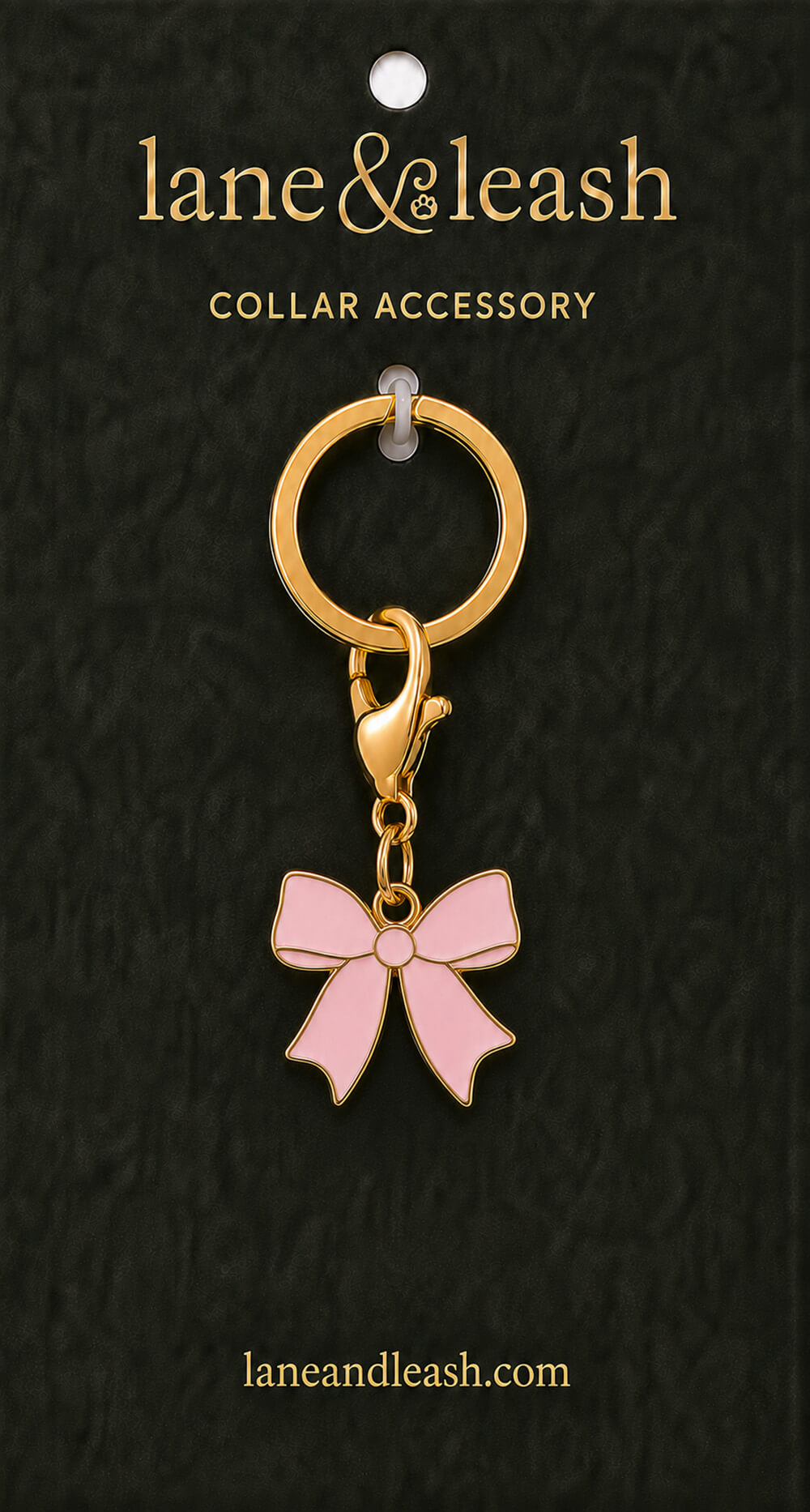 Pink bow Lane & Leash collar accessory charm on dark green packaging card with lobster claw clasp and jump ring