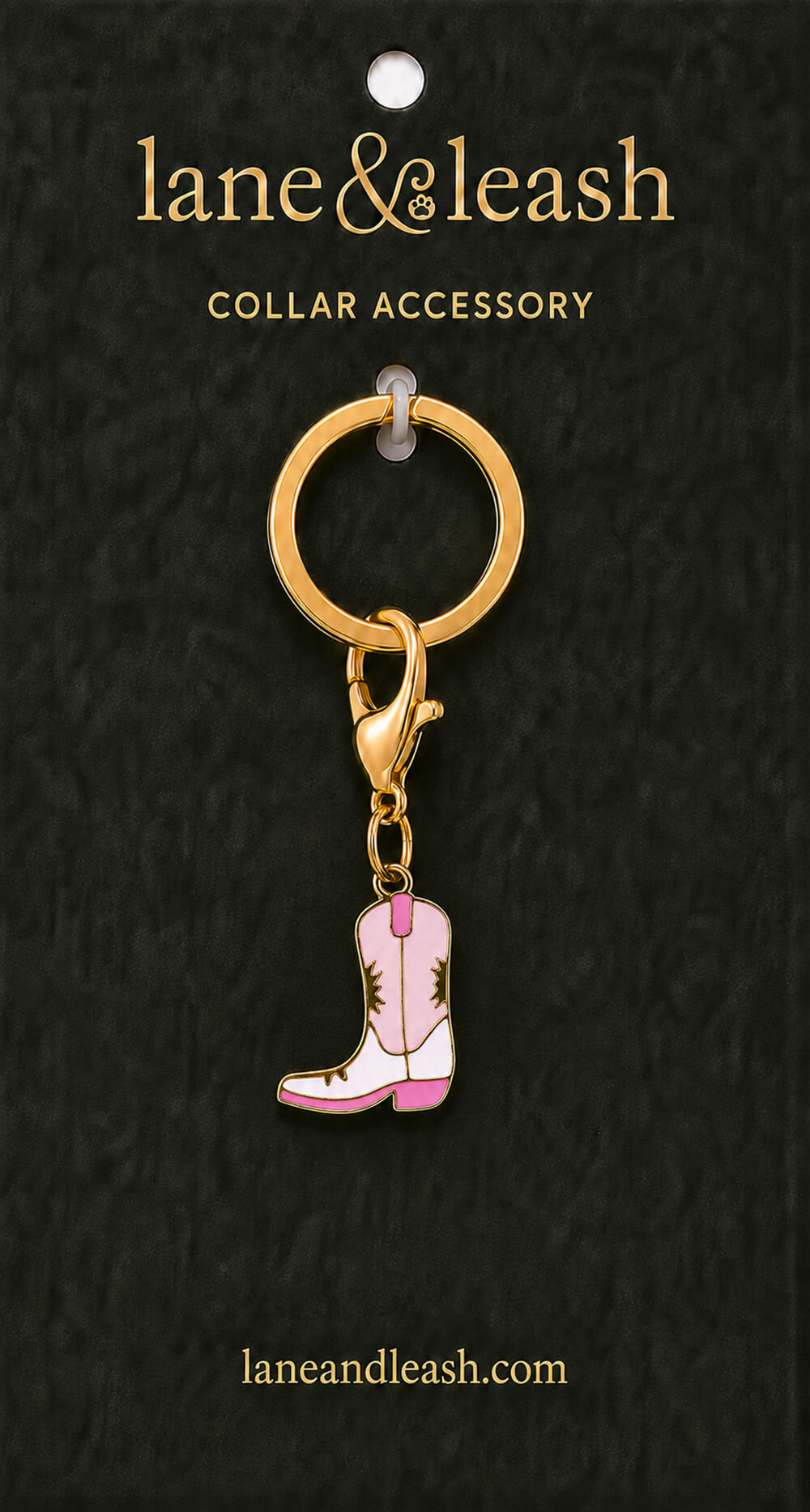 Pink cowgirl boot Lane & Leash collar accessory charm displayed on dark green packaging card with lobster claw clasp and jump ring