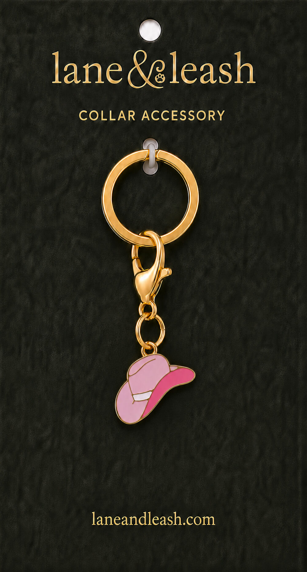 Pink cowgirl hat Lane & Leash collar accessory charm displayed on dark green packaging card with lobster claw clasp and jump ring