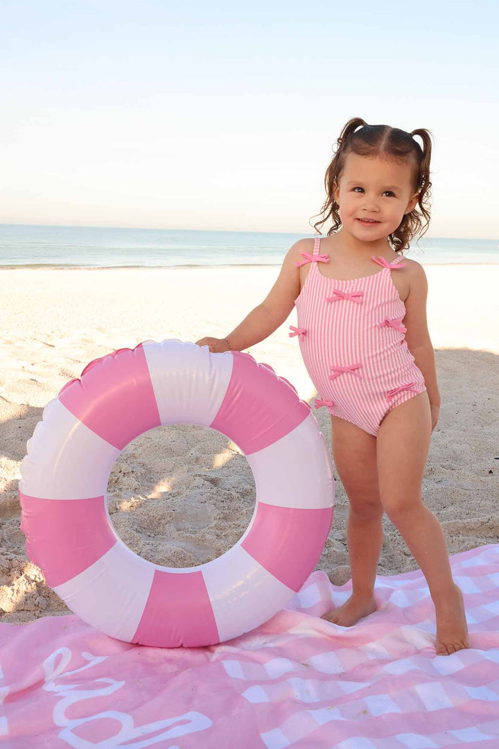 pink seersucker one piece swimsuit for girls with matching personalized towel