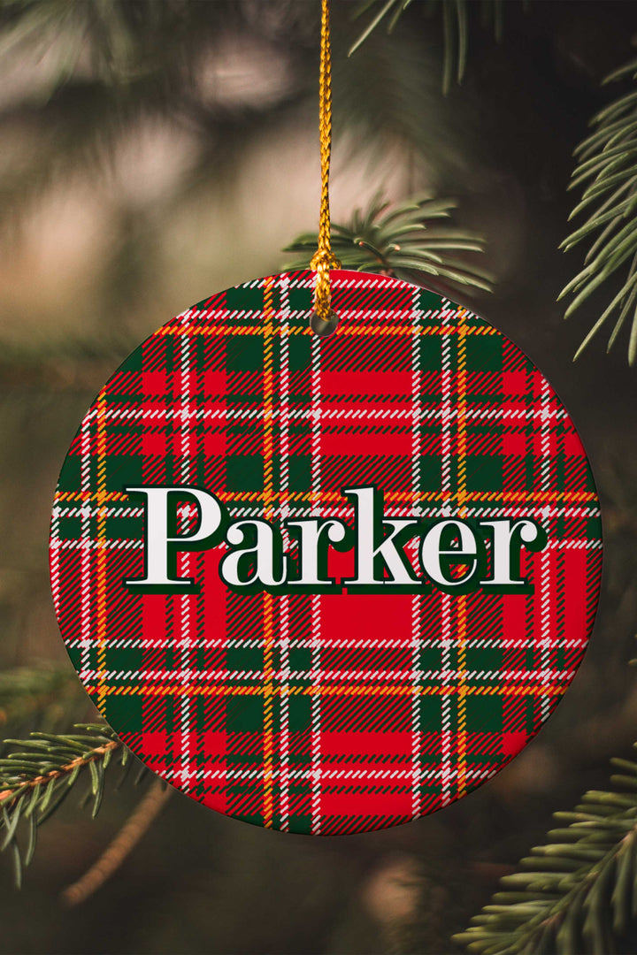 Caden Lane personalized Christmas ornament featuring a custom name on a classic red and green plaid design, perfect for matching family pajamas, festive tree décor, and personalized holiday gifts.