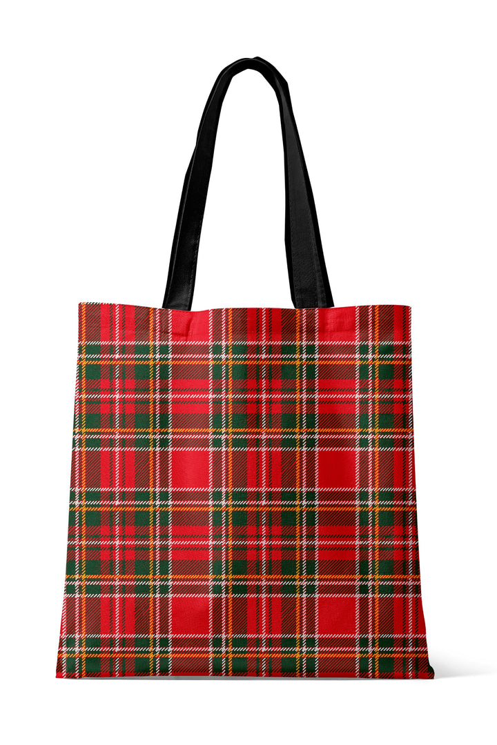 Back view of the Caden Lane Christmas tote bag in a classic red and green plaid print with durable black handles, perfect for festive holiday shopping, gift carrying, and everyday seasonal use.