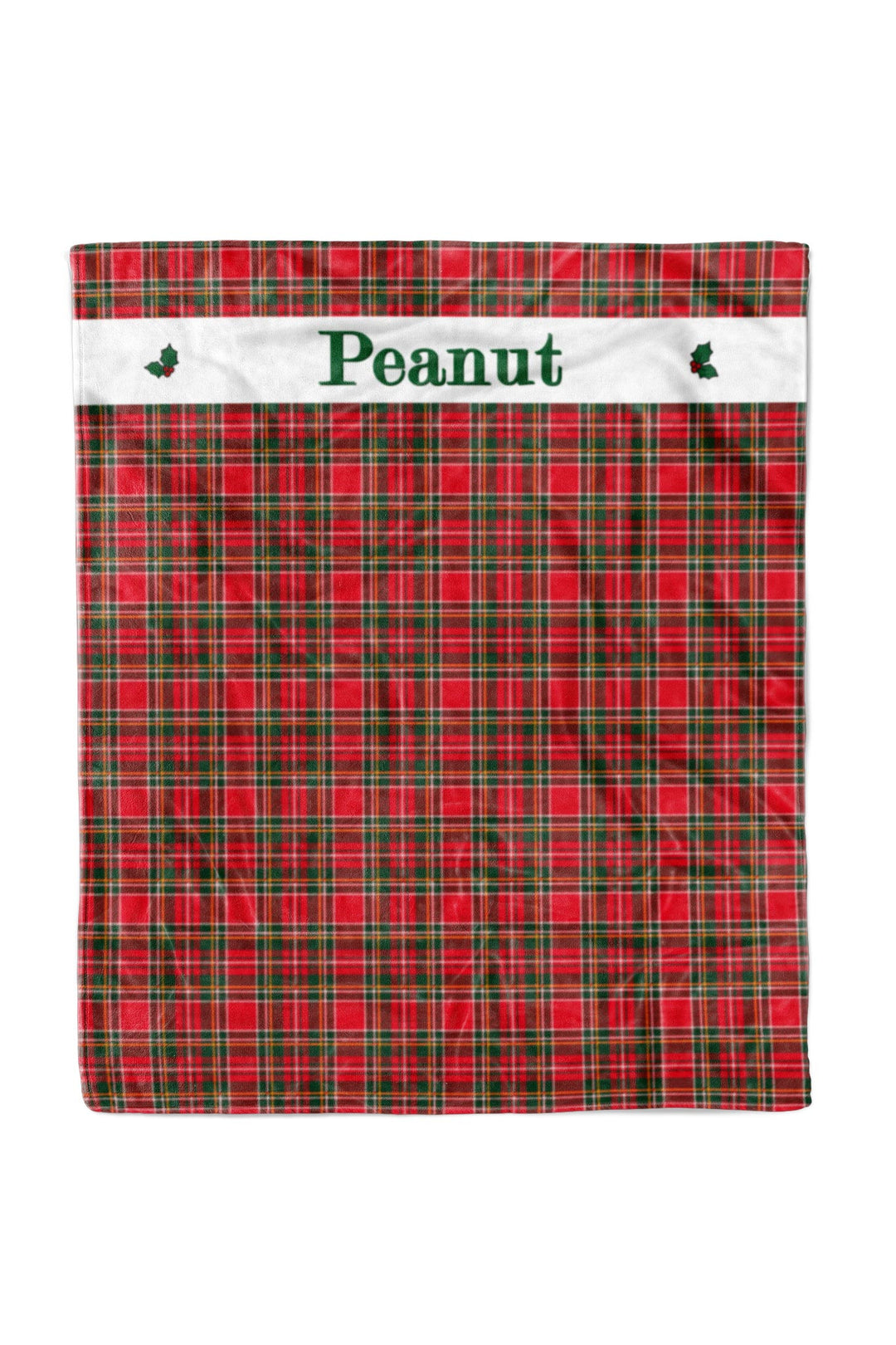 Lane & Leash personalized Christmas pet blanket featuring a red and green plaid pattern with a white horizontal banner across the top. The banner is personalized with the name 'Peanut' in green text and decorated with small green holly leaves on the sides.