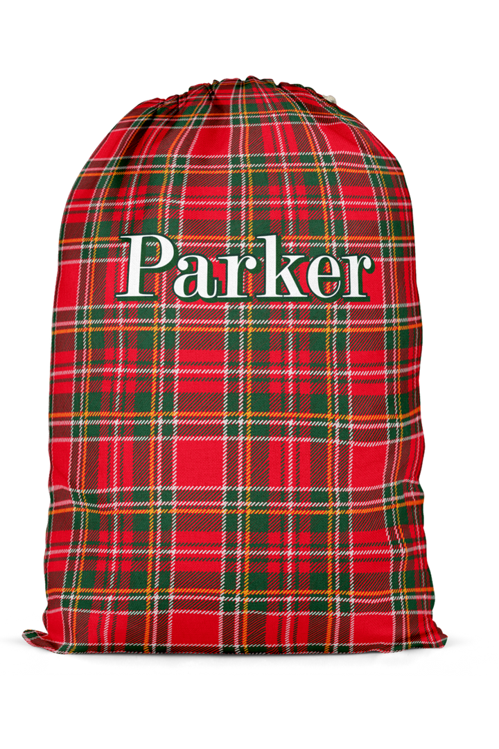 Caden Lane personalized Christmas Santa sack featuring a custom name on a classic red and green plaid design, perfect for holiday gift storage, matching family pajamas, and festive Christmas traditions.
