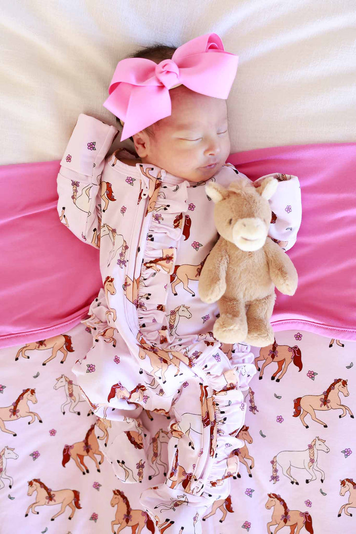 pony club pink ruffle zipper footie for girls with matching pink ribbon bow headband and mini pony stuffed animal 