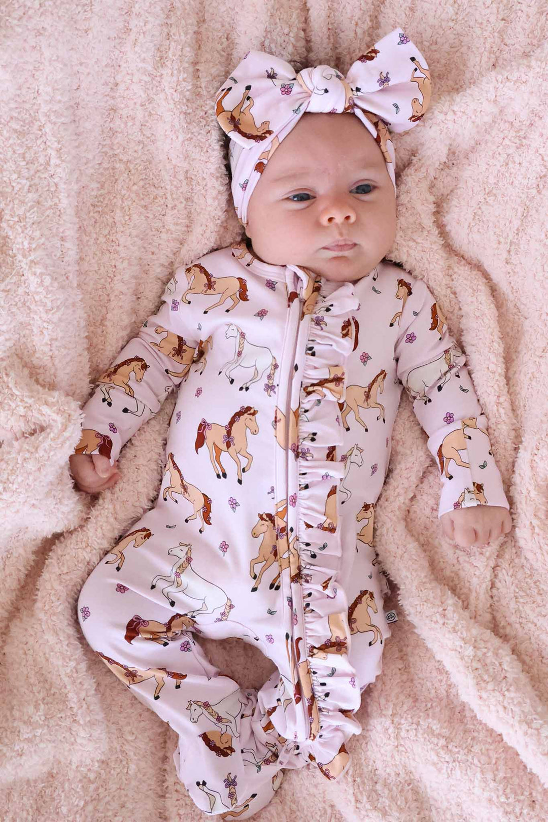 pony club pink ruffle zipper footie for girls with matching headwrap 