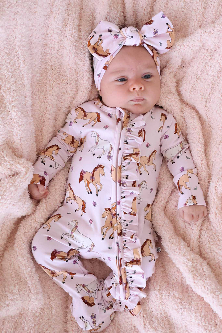 pony club pink ruffle zipper footie for girls with matching headwrap 