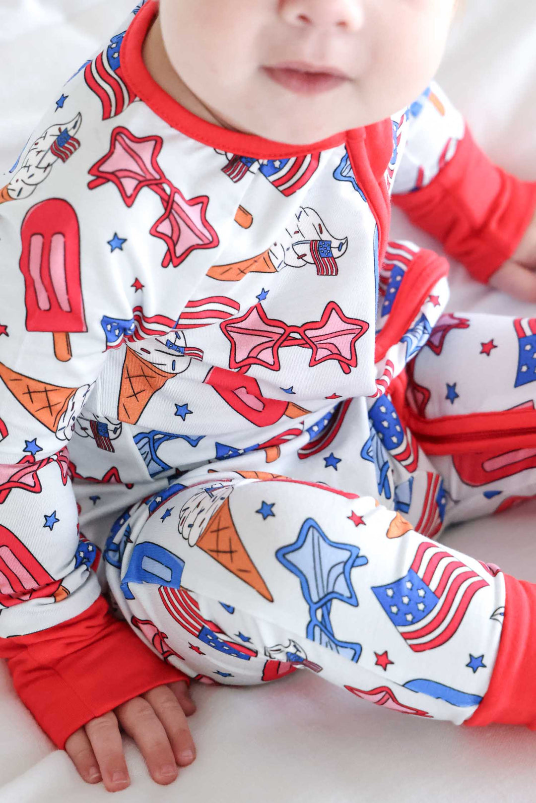 close-up of red white and cool convertible zip romper - patriotic bamboo baby romper