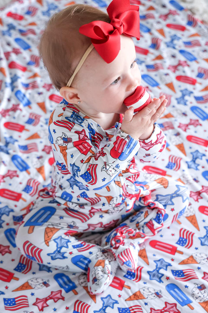 caden lane red white and cool ruffle footie flat lay - patriotic bamboo 4th of july infant outfit