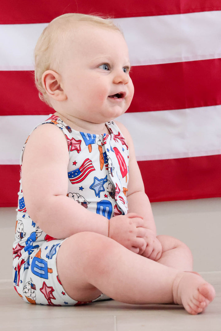 close-up of red white and cool sleeveless snap romper snaps - caden lane 4th of july baby