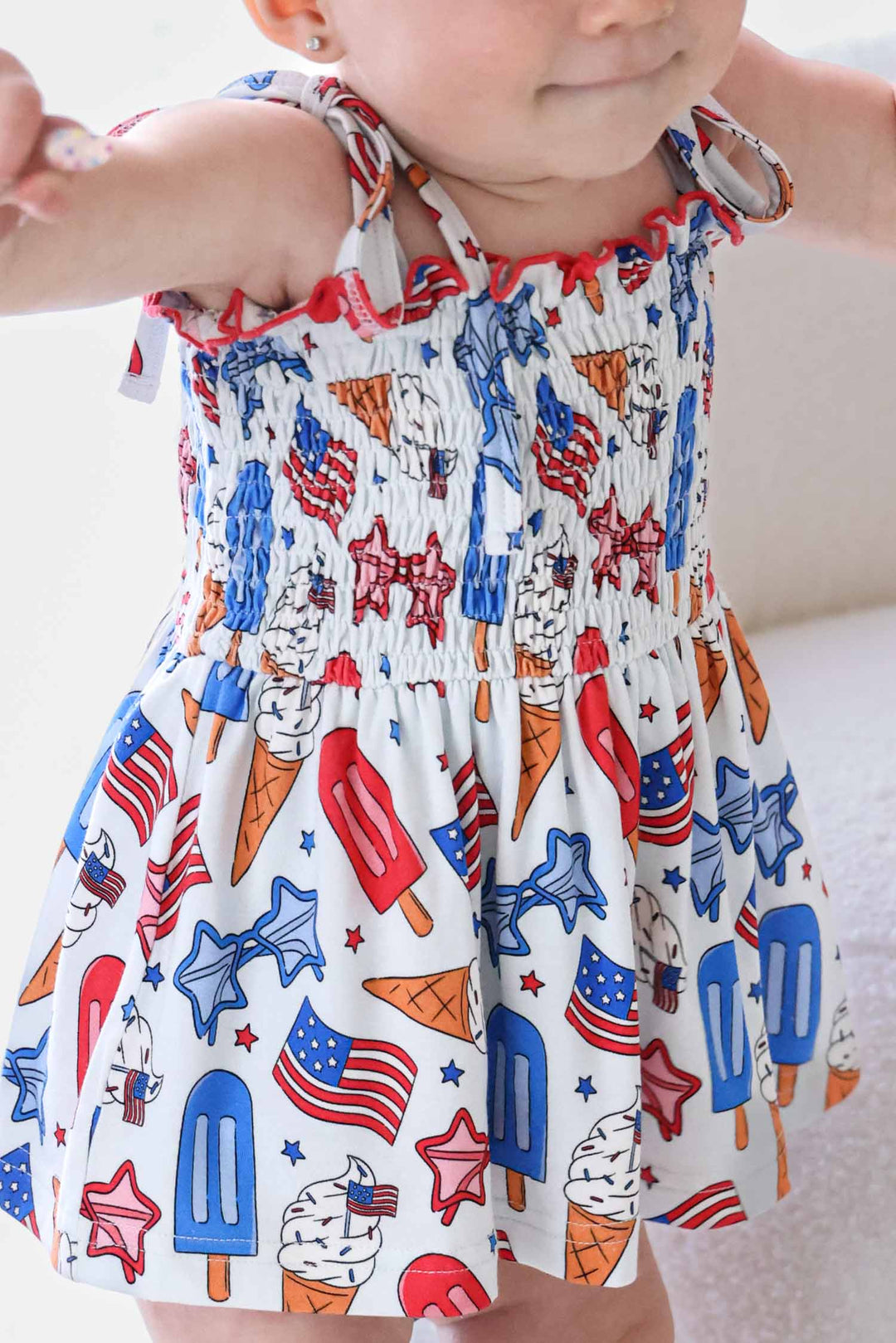 caden lane 4th of july smocked twirl bodysuit - red white and cool patriotic bamboo baby girl