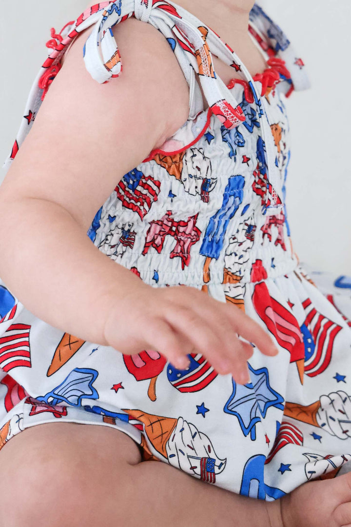 caden lane patriotic red white and cool smocked twirl bodysuit back view - 4th of july baby