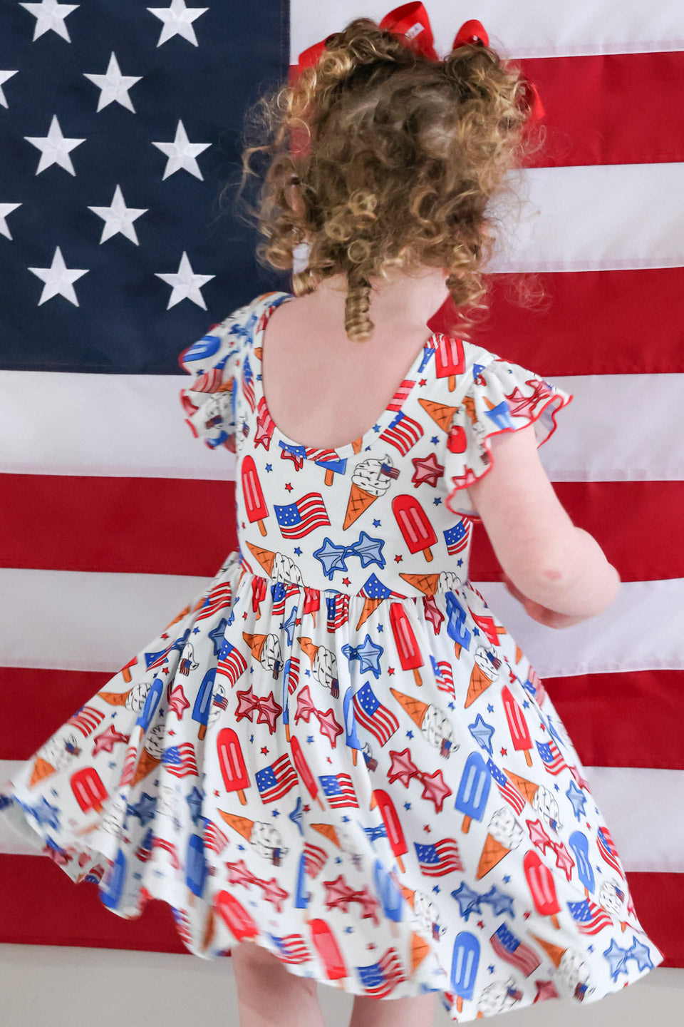 caden lane patriotic red white and cool ruffle twirl dress back view - 4th of july baby girl