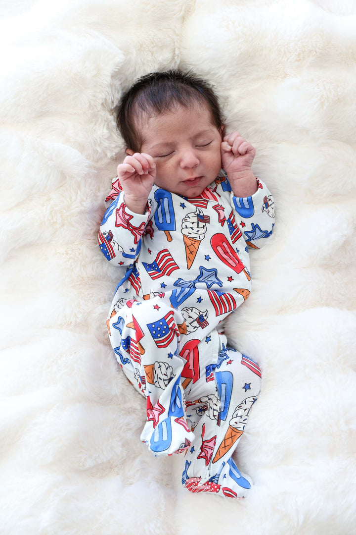 caden lane red white and cool bamboo footie flat lay - patriotic 4th of july infant outfit
