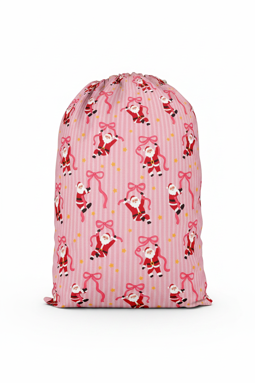 Caden Lane Jolly Ribbons Personalized Christmas Santa Sack back featuring an exclusive Santa and ribbon print on pink stripes, coordinating with matching family pajamas and holiday accessories.