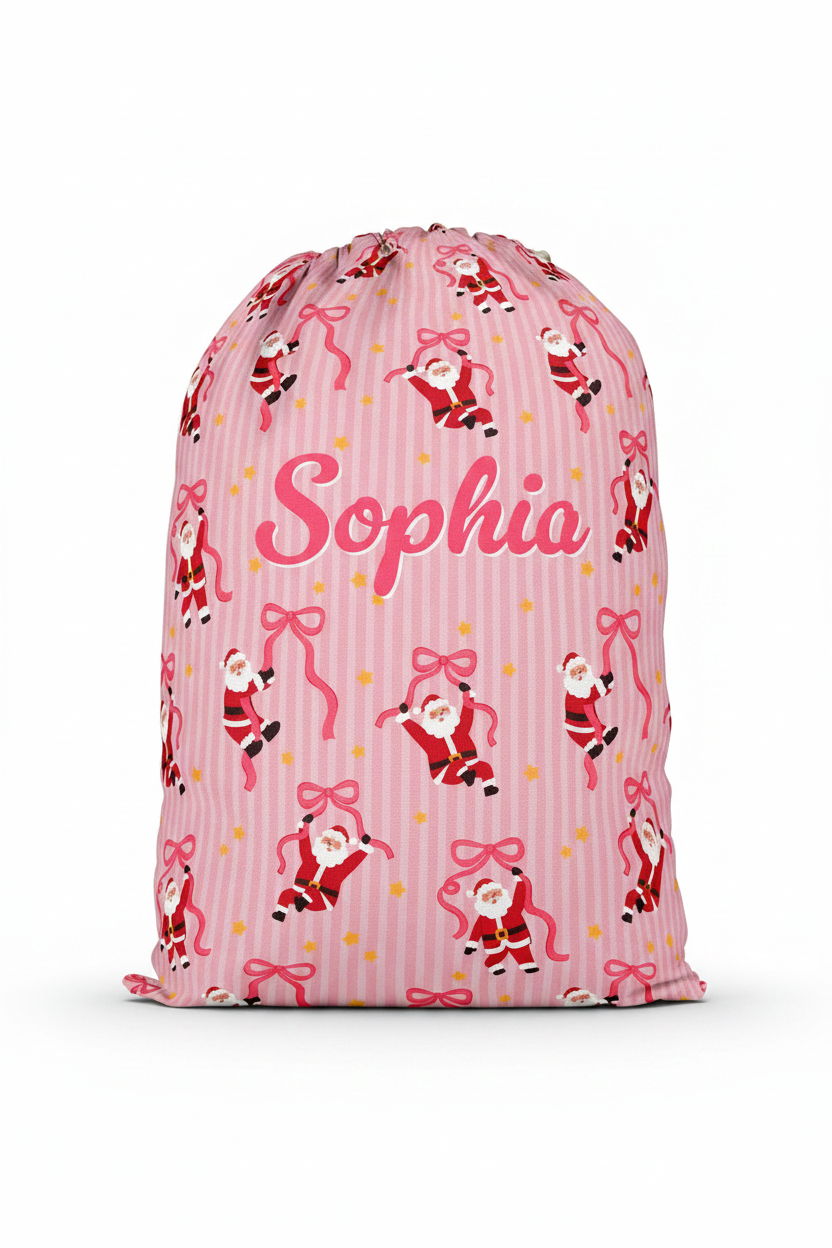 Personalized Caden Lane Jolly Ribbons Christmas Santa Sack featuring a custom name, festive pink stripes, whimsical Santa print, and ribbon design for Christmas gifts and holiday traditions.