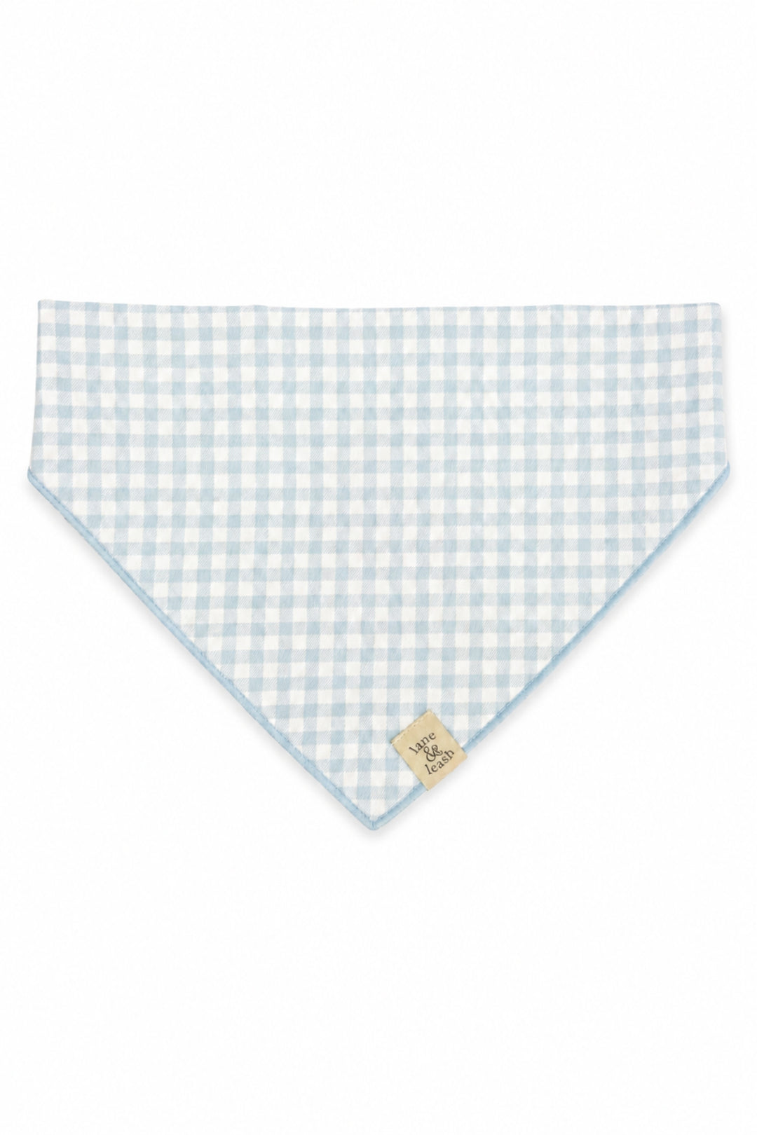 A Lane & Leash light blue and white gingham checkered pet bandana with a small beige brand tag, displayed flat against a white background.