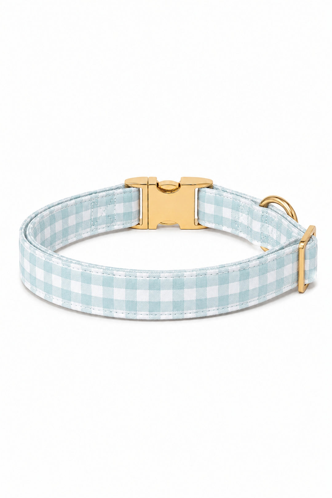 A Lane & Leash light blue and white gingham check dog collar with a gold-tone buckle and D-ring, shown on a clean white background.