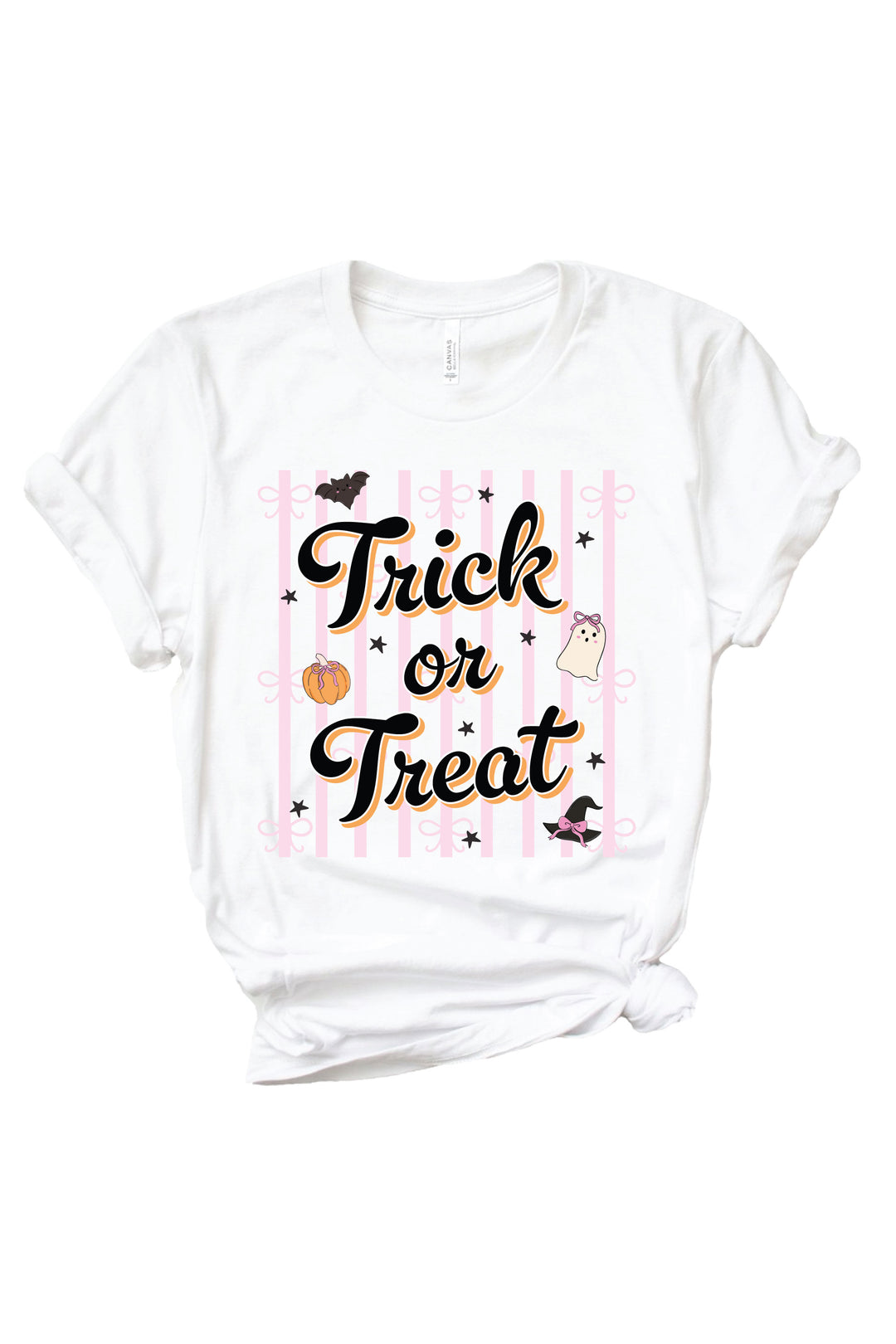 White Caden Lane t-shirt with 'Trick or Treat' script text over a pink striped background, decorated with a cute bat, ghost, and pumpkin with bows.
