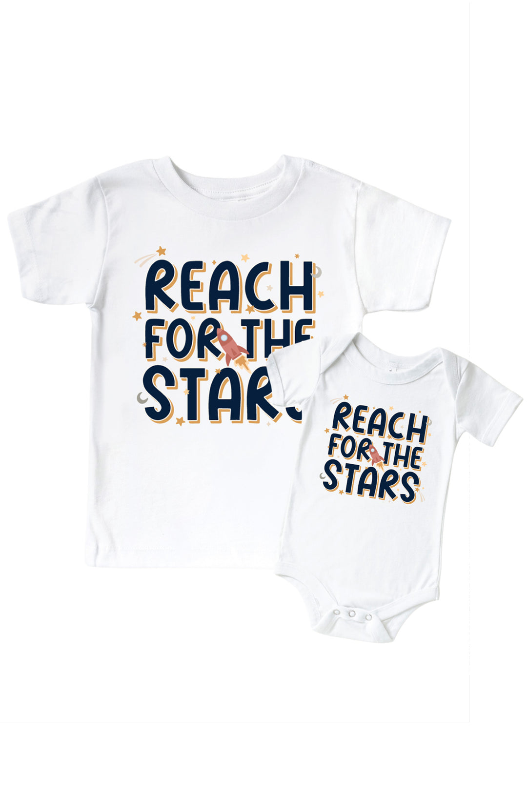 Flat lay of a matching Caden Lane white kids’ tee and bodysuit pair with a Stellar Snuggles graphic featuring a rocket, reading “Reach for the Stars.”