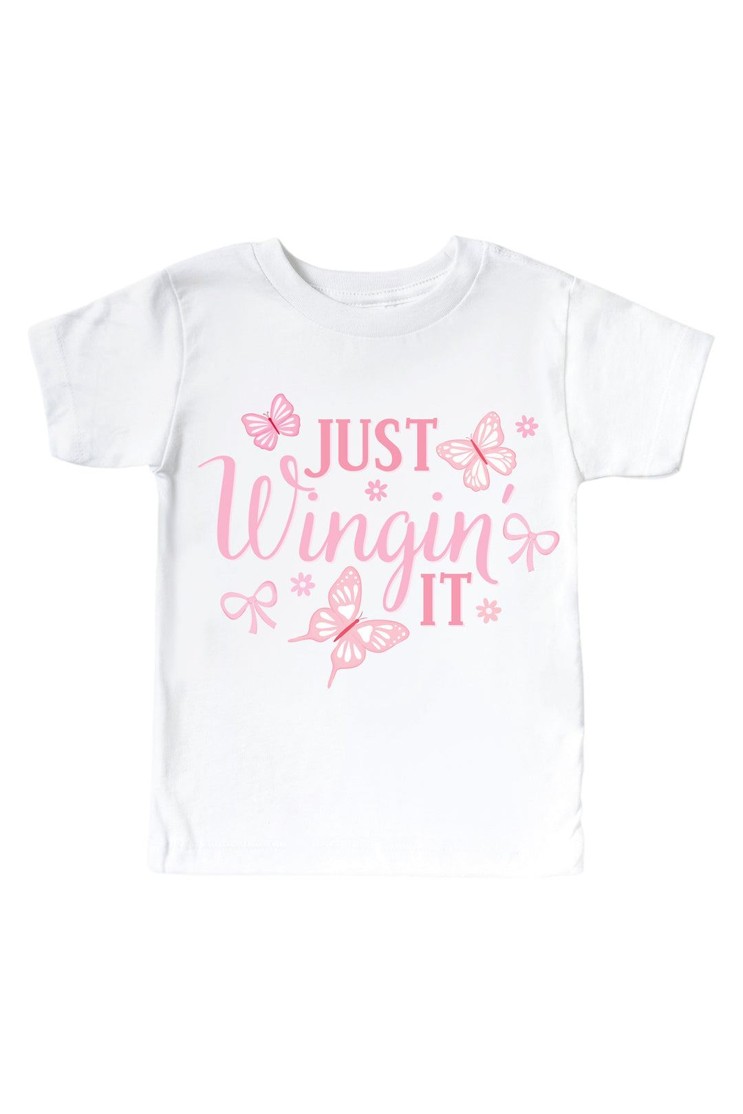 Just Wingin' It Graphic Kids Tee in Blooming Butterflies print - white tee featuring pink "Just Wingin' It" text with butterfly and bow accents