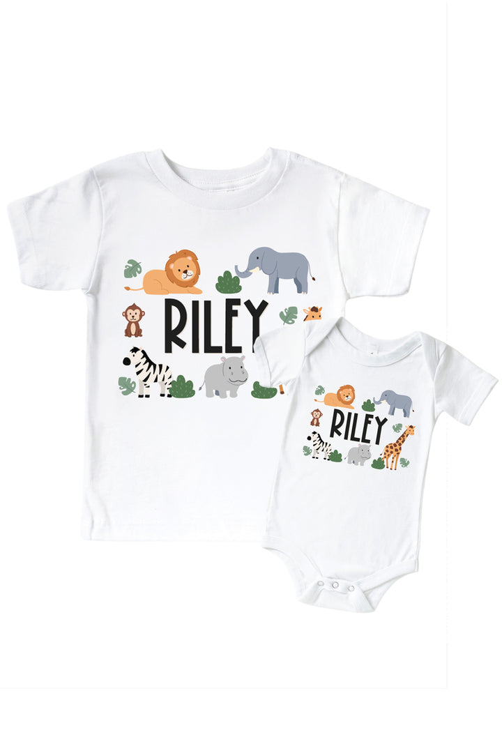 Caden Lane personalized matching sibling shirt set in white with the name "Riley" surrounded by safari animal illustrations, on both a kids' t-shirt and a baby bodysuit.