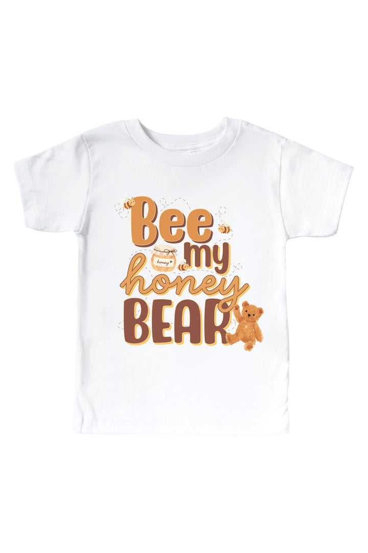 White t-shirt printed with 'Bee my honey bear' text, a honey jar, bees, and a teddy bear graphic, laid flat on a white background