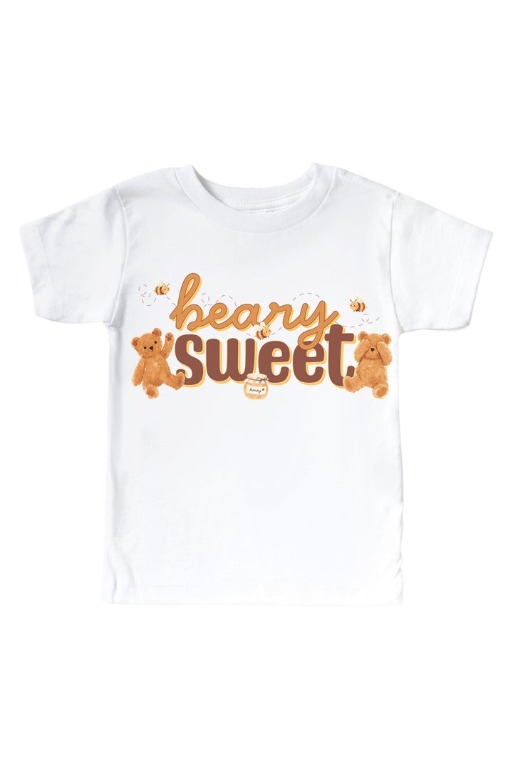White t-shirt with 'beary sweet' text, teddy bears, bees, and a honey jar graphic, laid flat on a white background
