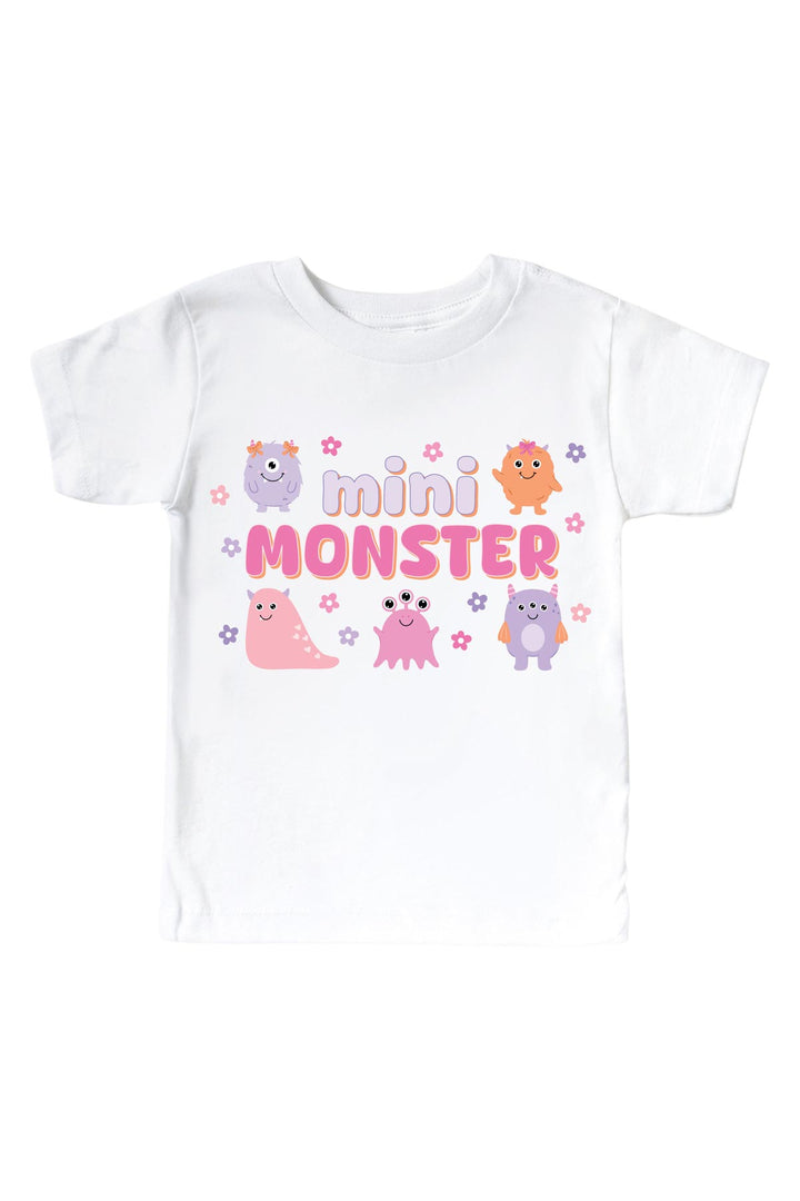 Caden Lane white kids t-shirt with "Mini Monster" graphic in purple and pink lettering, featuring pink, purple, and orange cartoon monsters and flowers