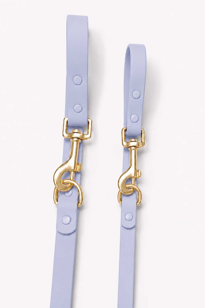 Close-up of cloud blue waterproof dog leash showing two gold snap hook clasps and leash straps side by side