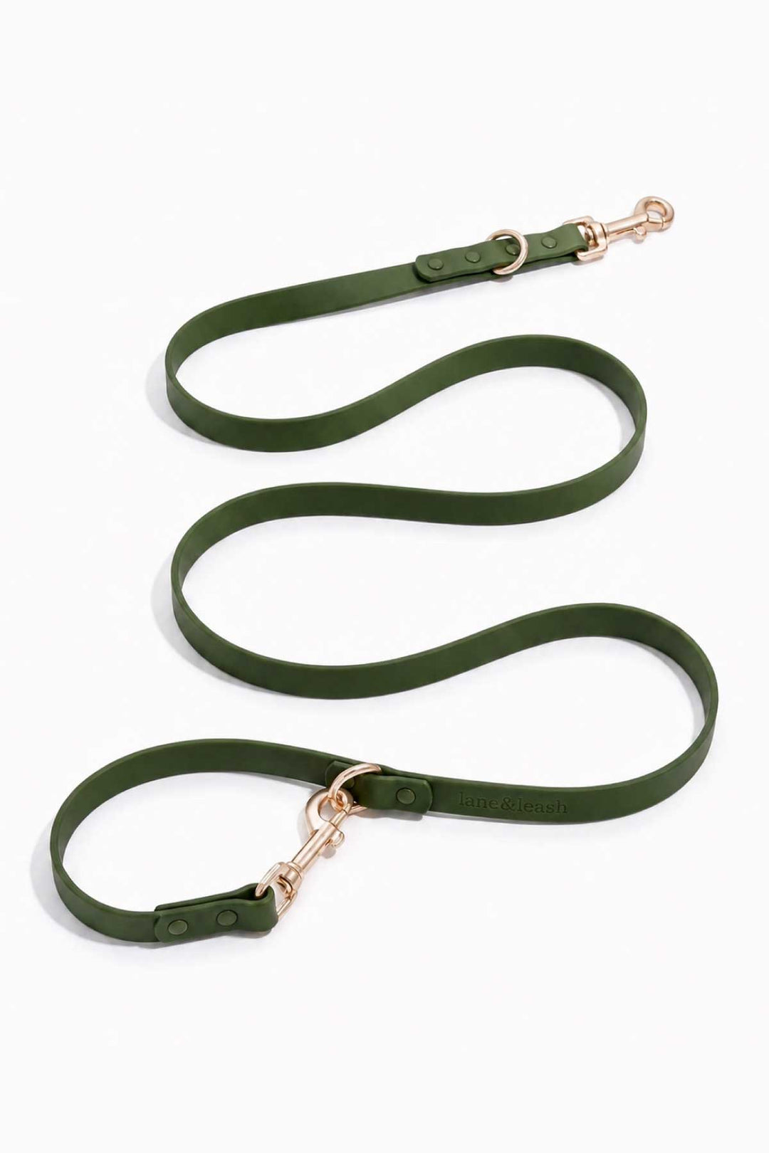 Waterproof silicone dog leash in clover green, showing full length with gold snap hook clasp and loop handle