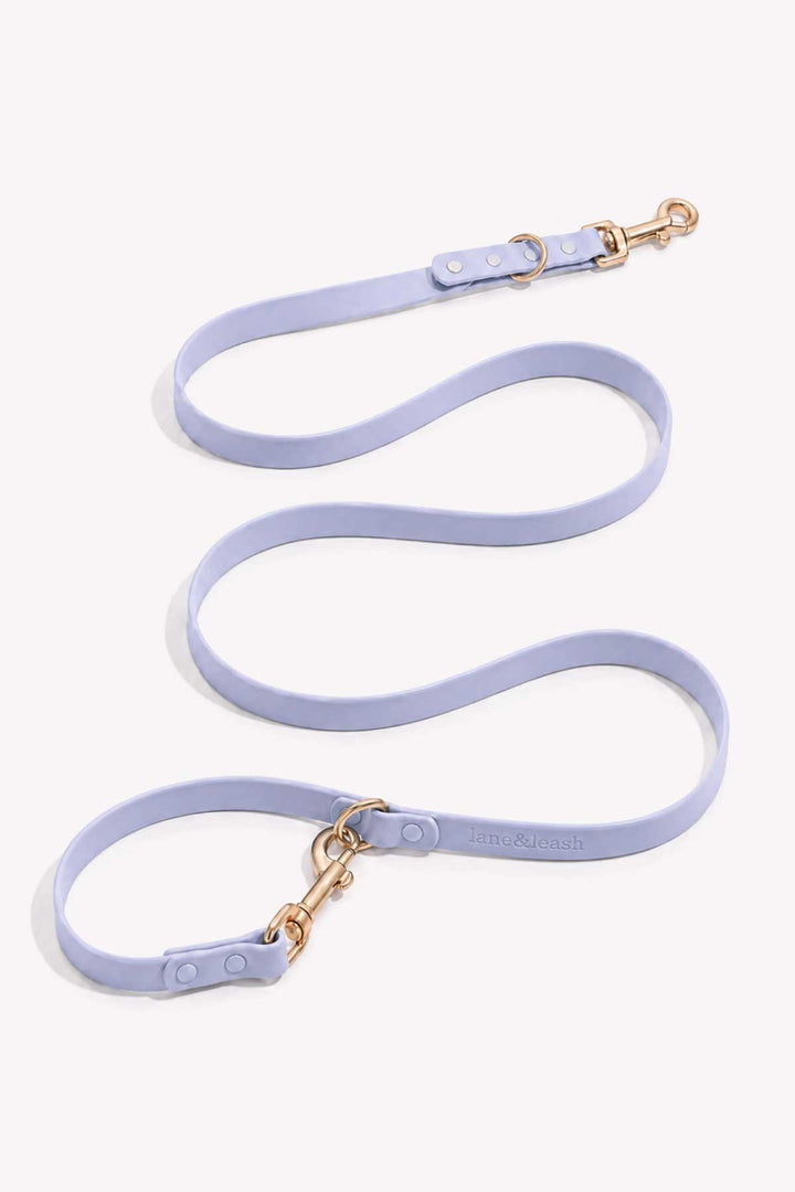 Waterproof silicone dog leash in lilac haze, showing full length with gold snap hook clasp and loop handle