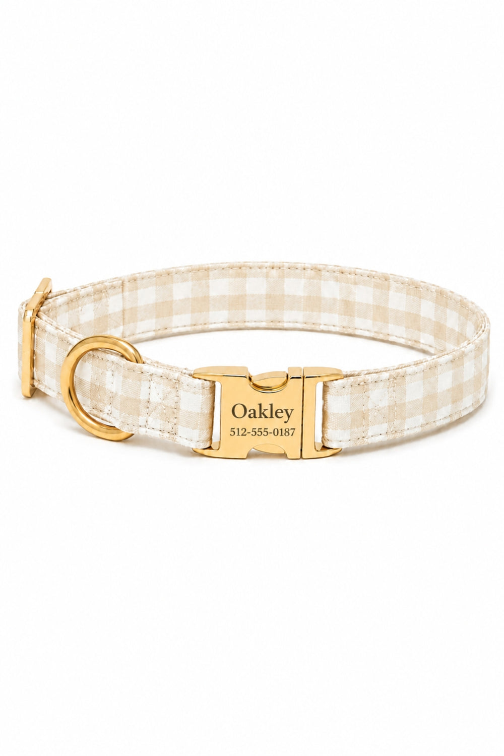 A Lane & Leash personalized dog collar with a beige and white gingham check pattern, featuring a gold-tone metal buckle engraved with the name 'Oakley' and a phone number, shown on a plain white background.