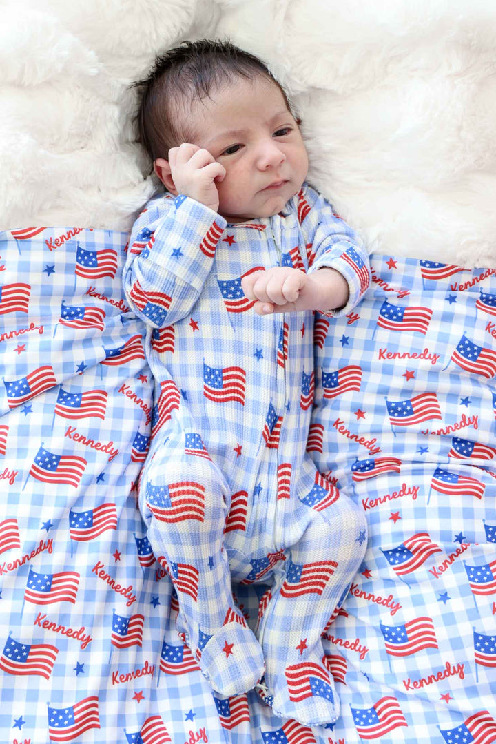 lifestyle photo of bamboo waffle swaddle blanket - star spangled picnic