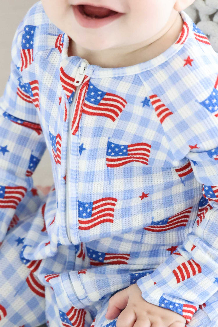 detail view of red bamboo waffle convertible zip romper - star spangled picnic