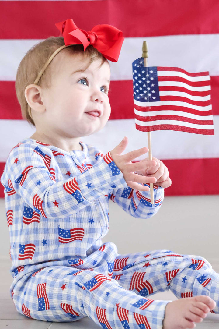 lifestyle photo of bamboo waffle convertible zip romper - star spangled picnic