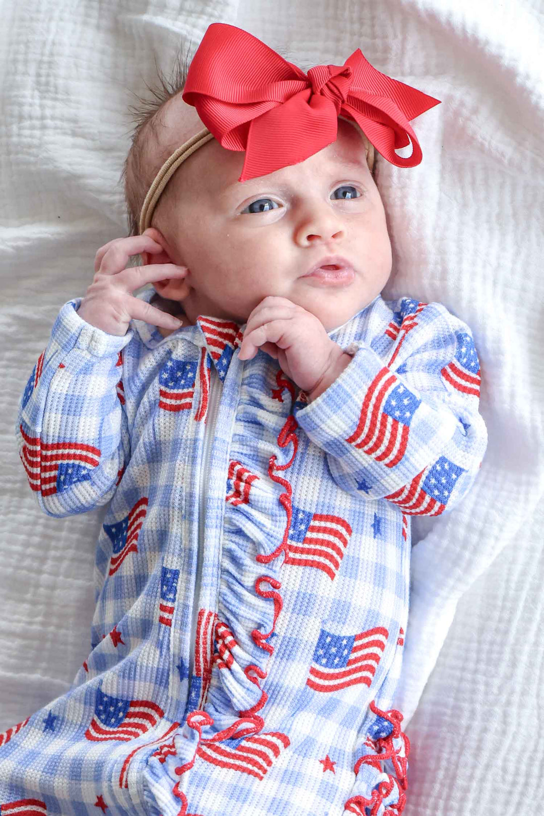 close-up of bamboo waffle star spangled picnic ruffle zipper footie
