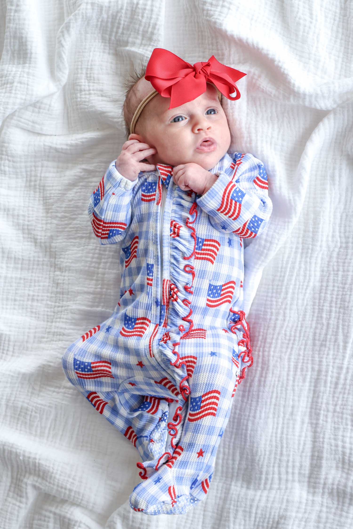 baby wearing bamboo waffle ruffle zipper footie in star spangled picnic - 4th of july