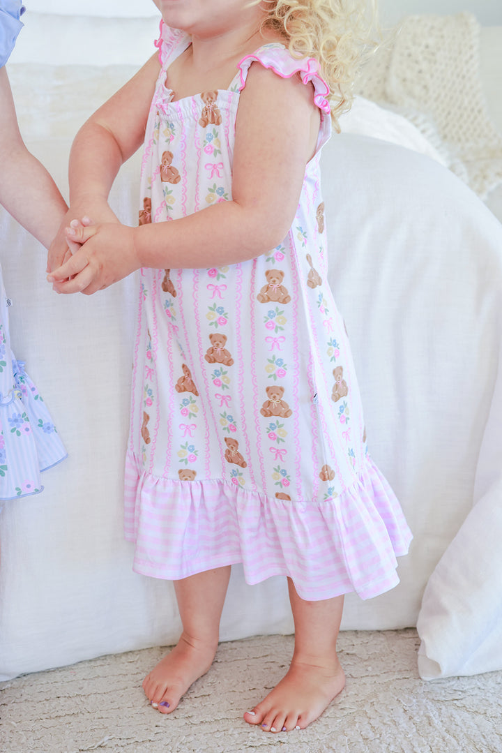 Young girl wearing Full Length Ruffle Nightgown in Beary Lovely print, body view showing teddy bear and floral stripe pattern with pink gingham ruffle hem