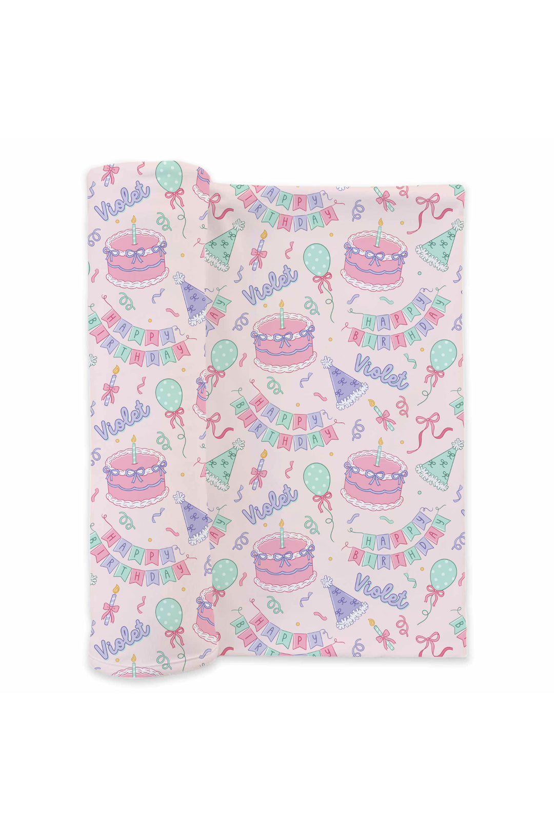 A Caden Lane folded baby swaddle with a light pink background and a colorful birthday print featuring cakes, balloons, banners, and happy birthday.