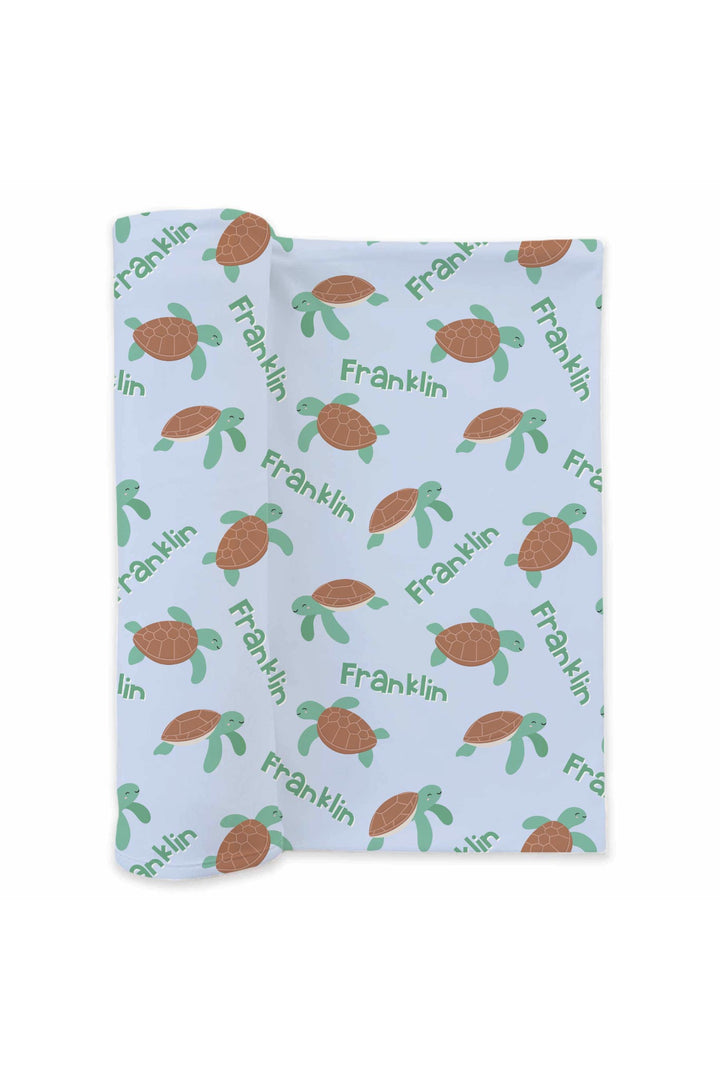 coastal cruisers swaddle blanket mockup featuring turtle print on bamboo waffle
