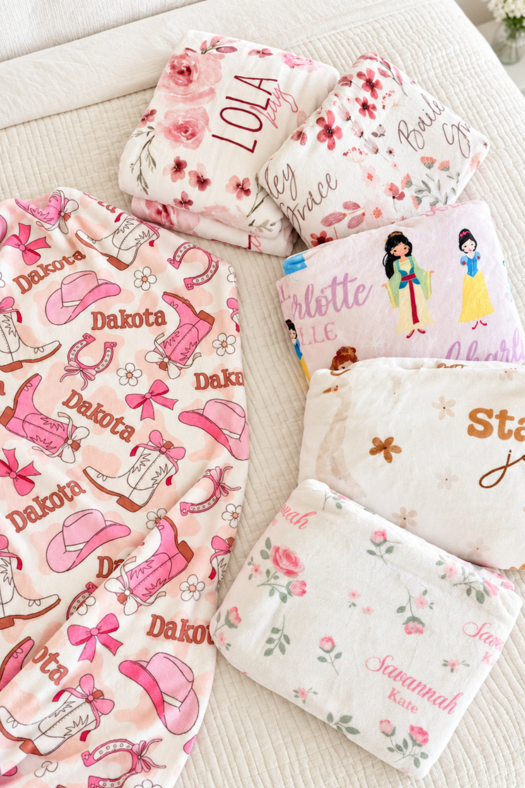 Group image of 5 personalzied Caden Lane girls themed blankets.