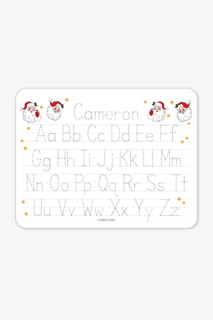 Caden Lane personalized Christmas handwriting practice board featuring the name "Cameron" in festive red and green plaid lettering with traceable uppercase and lowercase alphabet, creating a fun personalized holiday learning gift for kids.