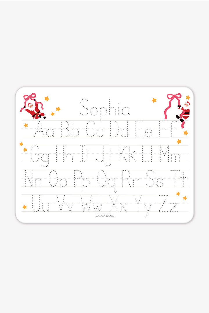 Caden Lane Personalized Kids' Christmas Whiteboard in the Jolly Ribbons print featuring a custom name, reusable dry-erase handwriting practice board with festive Santa and ribbon design for holiday learning and personalized Christmas gifts.