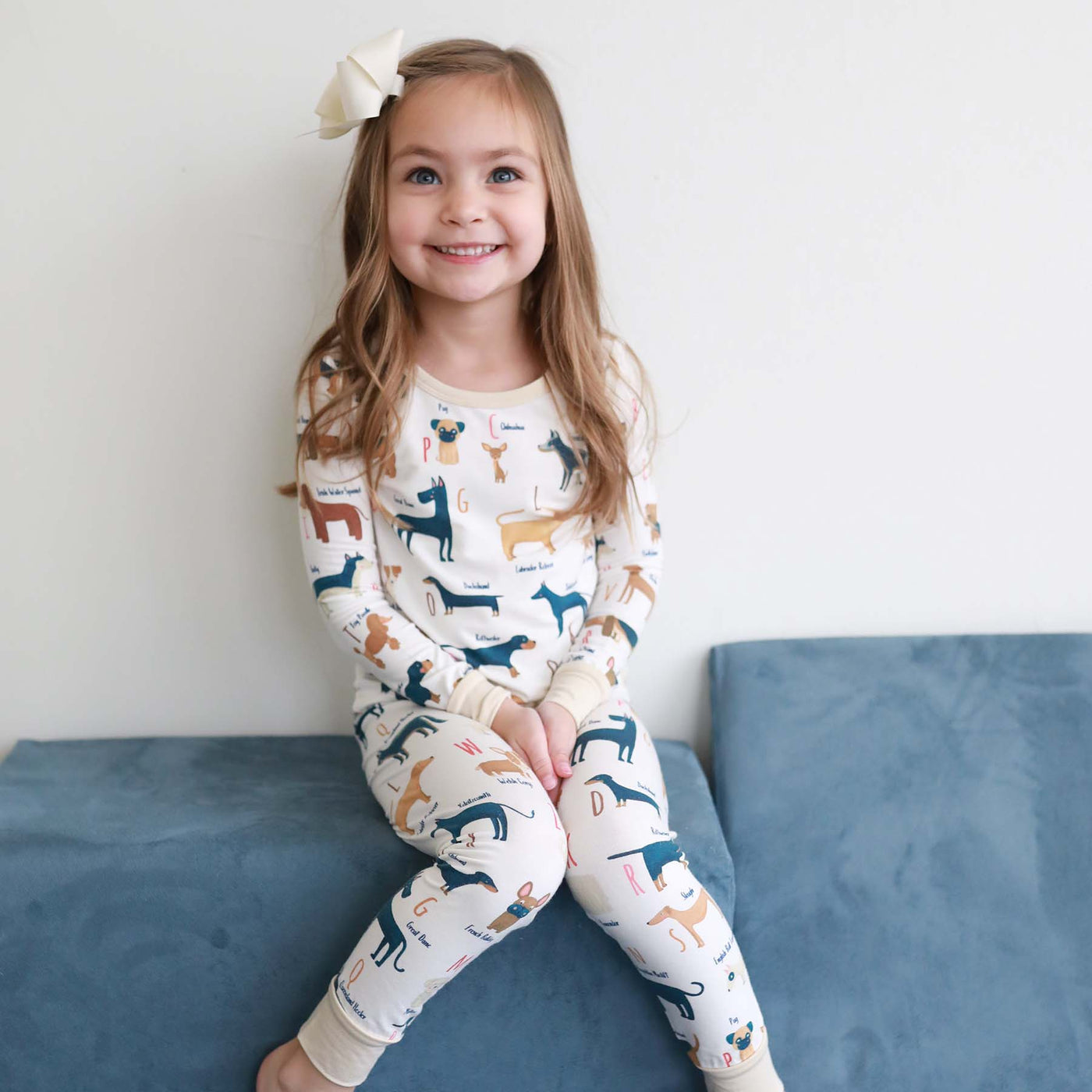 two piece pajama set for kids gender neutral with dogs and letters 