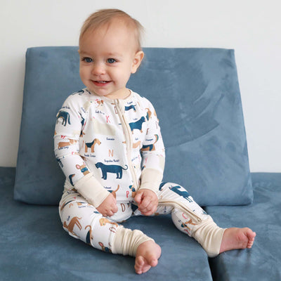 pajama romper for toddlers with dogs and letters of the alphabet 