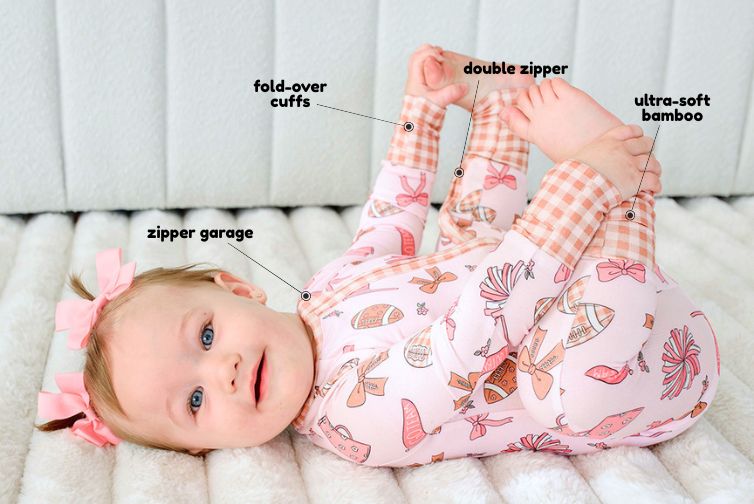 Romper feature call-outs: zipper garage, fold-over cuffs, double zipper, ultra-soft bamboo